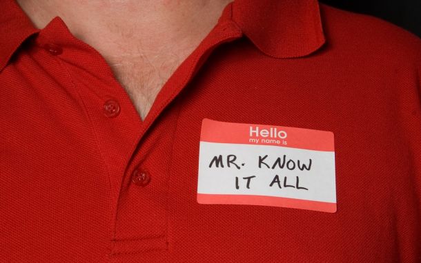 Image of a manager with "Mr.Know-It-All" title