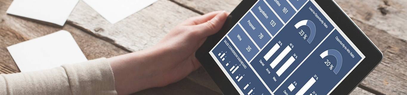women looking at important sales KPIs on a tablet
